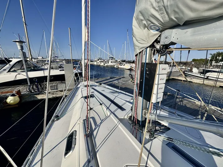  Yacht Photos Pics Sailboat docked at marina, Beneteau 45 First, 1991 model, sunny day.