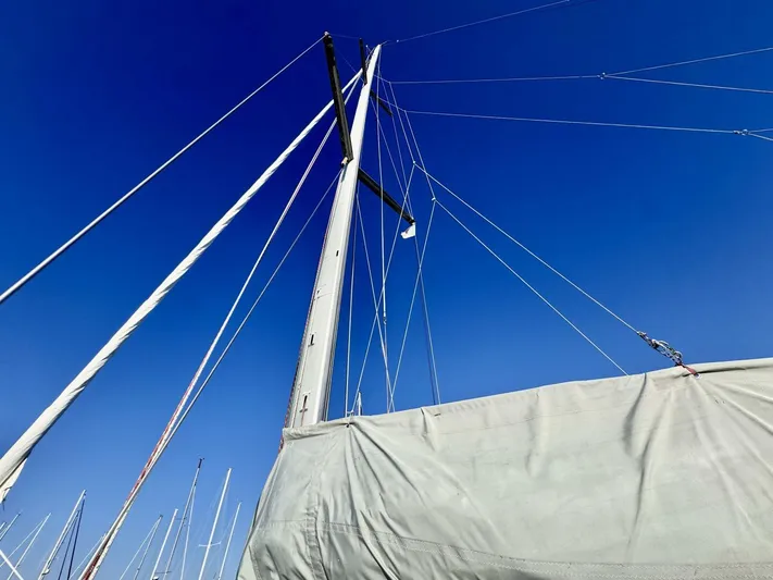  Yacht Photos Pics Sailboat mast and rigging of 1991 Beneteau 45 First against clear blue sky.