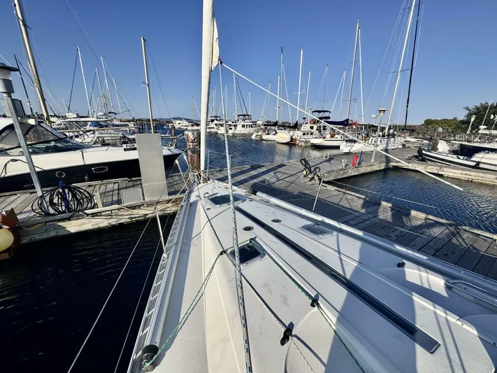  Yacht Photos Pics Sailboats docked at a marina, featuring a 1991 Beneteau 45 First.