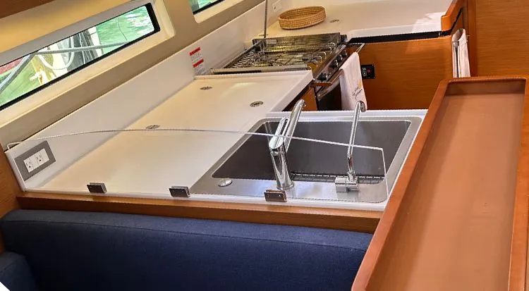 Nautical Dreamer Yacht Photos Pics Modern kitchen in 2019 Jeanneau Sun Odyssey 490 yacht with sink and stove.