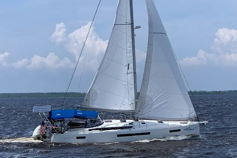 Nautical Dreamer Yacht Photos Pics 2019 Jeanneau Sun Odyssey 490 sailing on open water under clear skies.