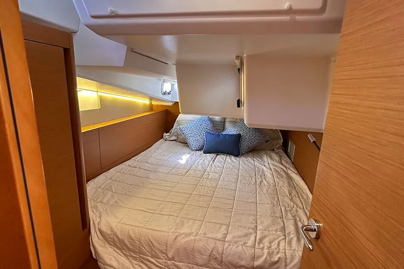 Nautical Dreamer Yacht Photos Pics Cozy cabin interior of 2019 Jeanneau Sun Odyssey 490 with comfortable bedding.