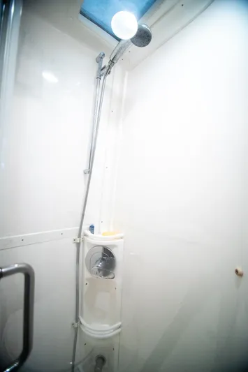 Pura Vita Yacht Photos Pics Shower area in a 2006 Intrepid 377 WA boat, featuring a sleek, modern design.