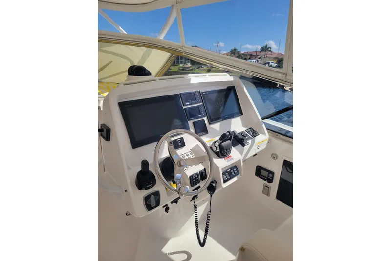 Previous Freshwater !! Yacht Photos Pics Helm of 2016 Intrepid 475 Sport Yacht with modern navigation equipment and steering wheel.