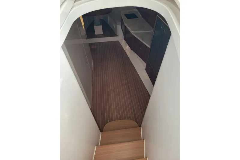 Previous Freshwater !! Yacht Photos Pics Interior view of 2016 Intrepid 475 Sport Yacht, featuring wooden flooring and modern design.