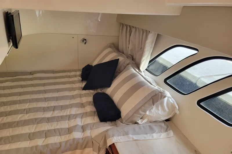 Previous Freshwater !! Yacht Photos Pics Cozy cabin interior of 2016 Intrepid 475 Sport Yacht with striped bedding and windows.