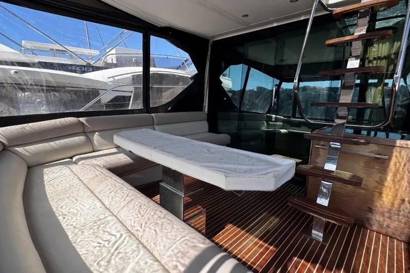  Yacht Photos Pics Luxurious interior of 2018 Beneteau Gran Turismo 50 Sportfly yacht with elegant seating and staircase.