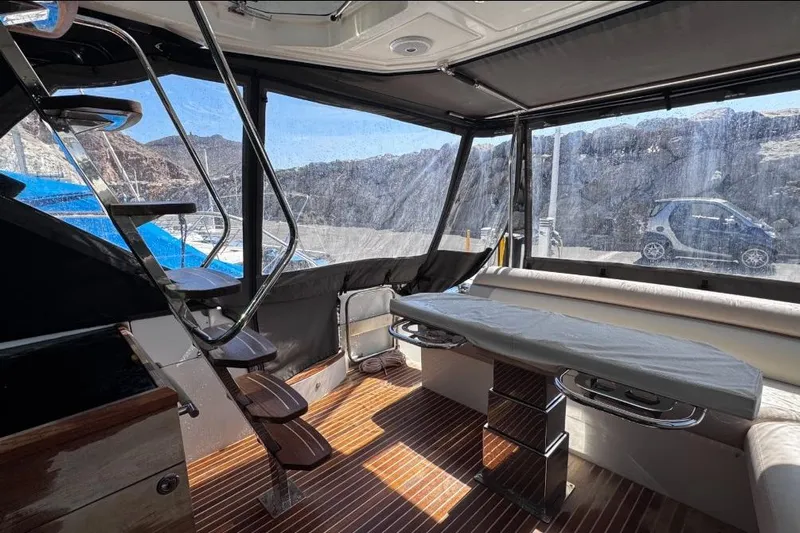  Yacht Photos Pics Interior of 2018 Beneteau Gran Turismo 50 Sportfly with modern seating and staircase.