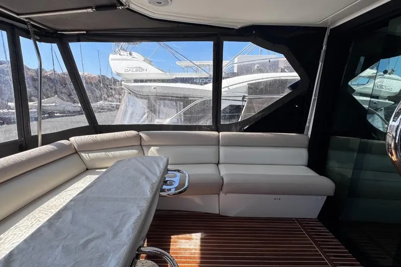  Yacht Photos Pics Interior of 2018 Beneteau Gran Turismo 50 Sportfly with luxurious seating and wooden flooring.