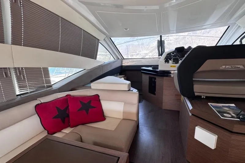  Yacht Photos Pics Interior of 2018 Beneteau Gran Turismo 50 Sportfly yacht with modern seating and helm.
