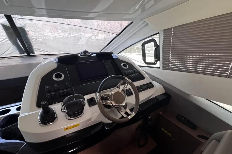  Yacht Photos Pics Cockpit of 2018 Beneteau Gran Turismo 50 Sportfly with modern controls and steering wheel.