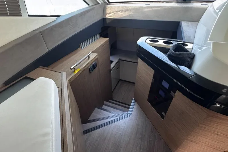  Yacht Photos Pics Interior of 2018 Beneteau Gran Turismo 50 Sportfly yacht, featuring modern wood finishes and sleek design.