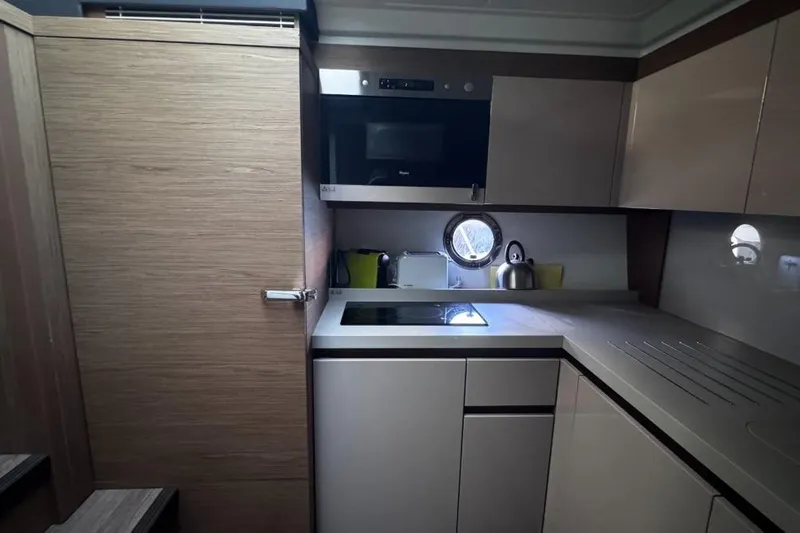  Yacht Photos Pics Modern kitchen interior of 2018 Beneteau Gran Turismo 50 Sportfly yacht.