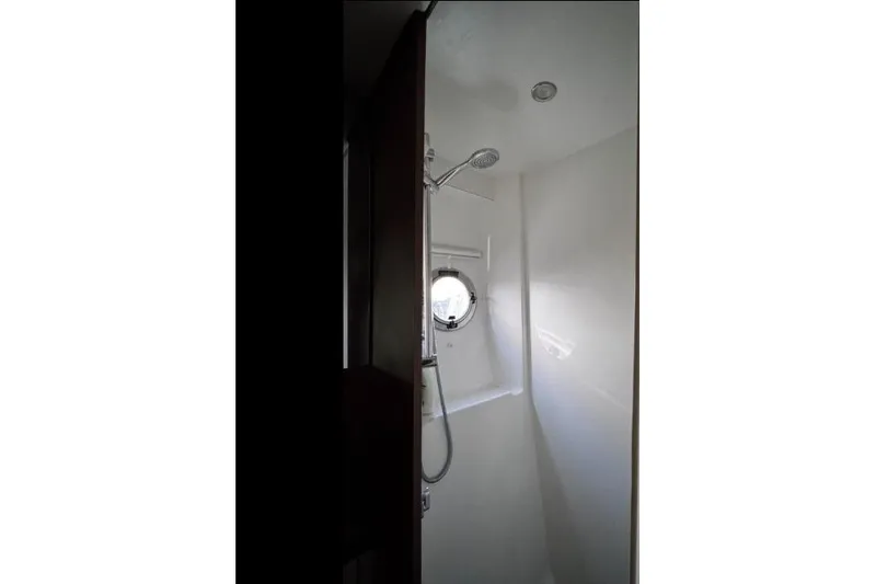  Yacht Photos Pics Shower area in 2018 Beneteau Gran Turismo 50 Sportfly yacht with porthole window.