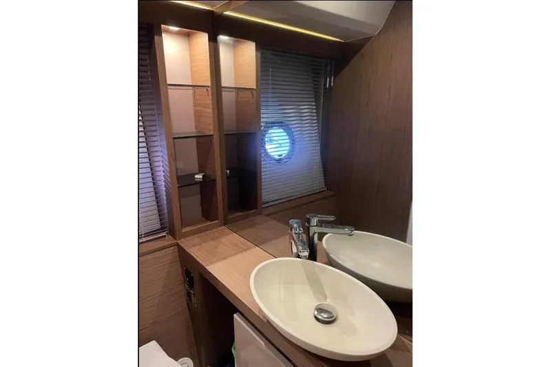  Yacht Photos Pics Luxurious bathroom in 2018 Beneteau Gran Turismo 50 Sportfly yacht with modern sink and porthole.