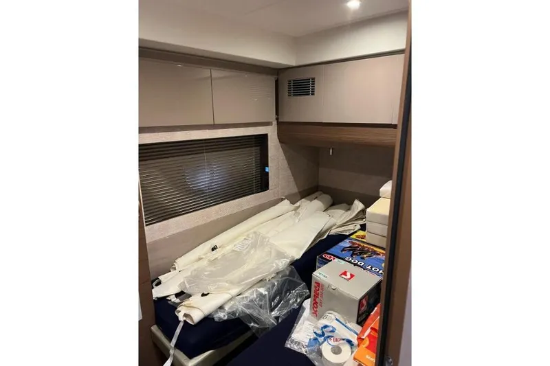  Yacht Photos Pics Interior cabin of 2018 Beneteau Gran Turismo 50 Sportfly with storage items.