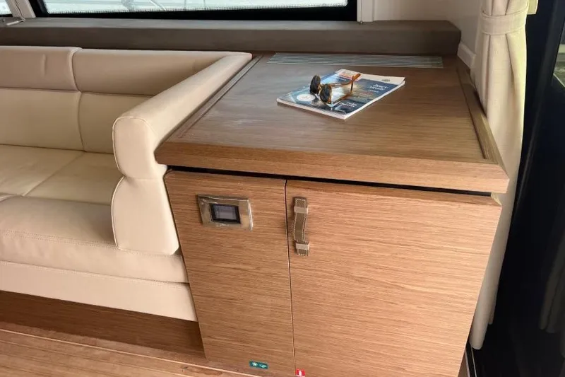  Yacht Photos Pics Luxurious interior of 2018 Beneteau Gran Turismo 50 Sportfly yacht with wooden cabinetry.