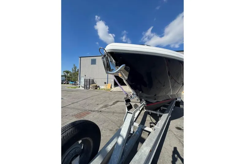  Yacht Photos Pics 2018 Intrepid 32 boat on trailer under clear blue sky.