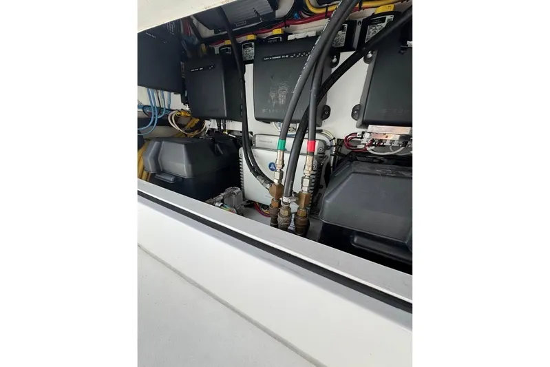  Yacht Photos Pics Engine compartment of a 2018 Intrepid 32 boat, showcasing wiring and components.