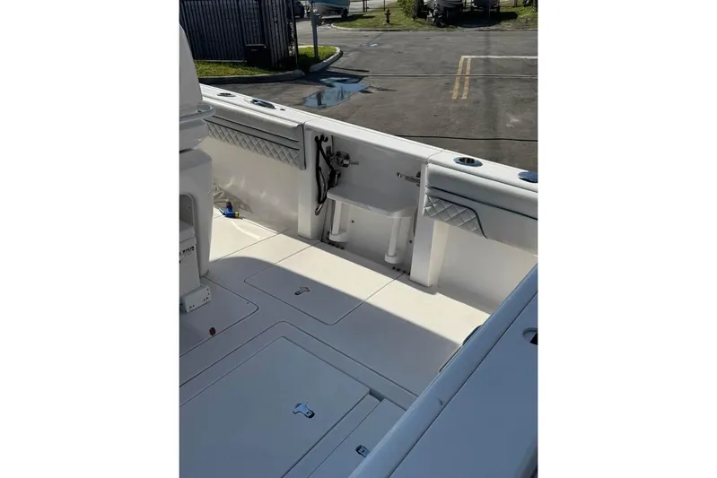 Yacht Photos Pics 2018 Intrepid 32 boat interior with clean deck and seating area.