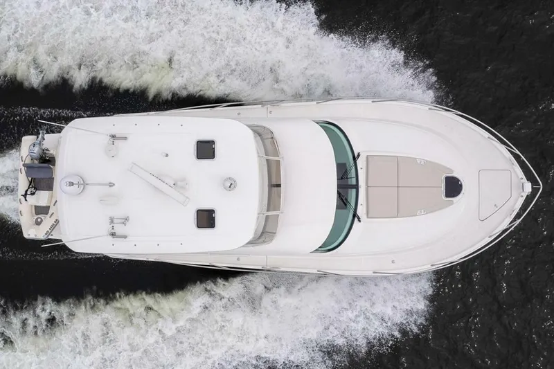  Yacht Photos Pics Overhead view of 2021 Tiara Yachts F44 Flybridge cruising on water.