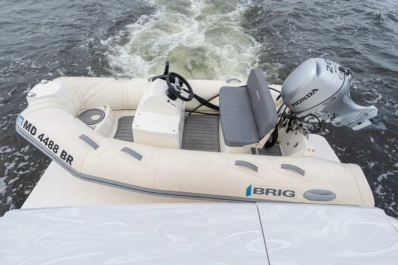  Yacht Photos Pics Inflatable boat with Honda motor on Tiara Yachts F44 Flybridge, 2021 model.