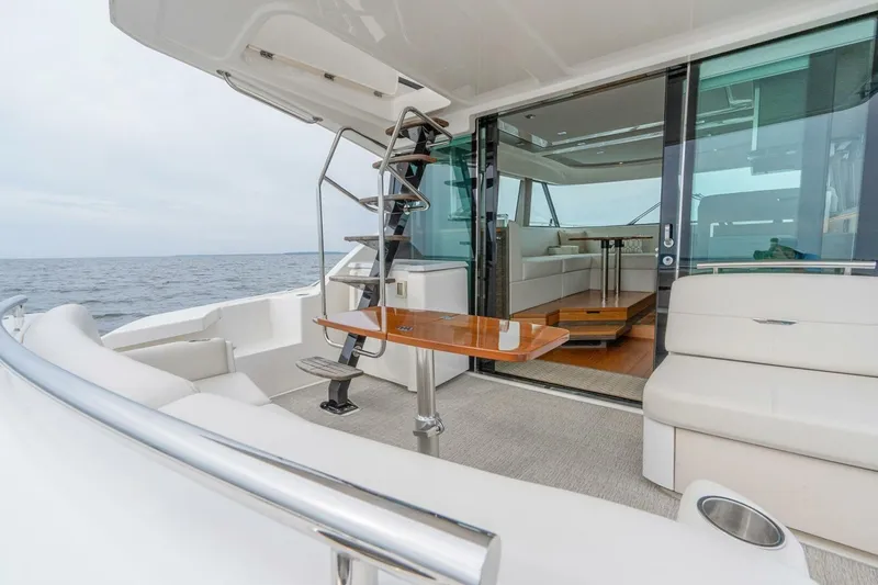  Yacht Photos Pics Luxurious 2021 Tiara Yachts F44 Flybridge with elegant seating and ocean view.