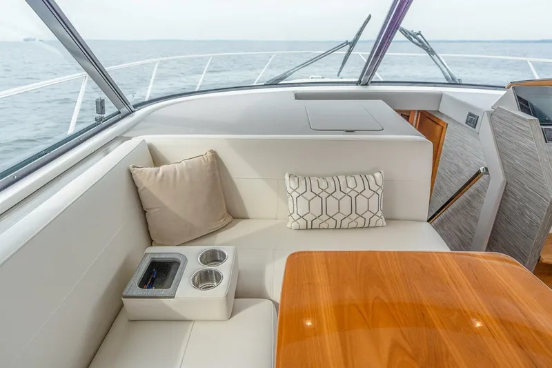  Yacht Photos Pics Luxurious interior of 2021 Tiara Yachts F44 Flybridge with plush seating and ocean view.