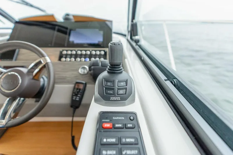  Yacht Photos Pics 2021 Tiara Yachts F44 Flybridge helm with joystick and control panel.