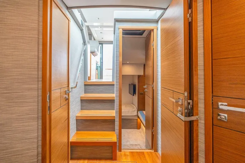  Yacht Photos Pics Interior of 2021 Tiara Yachts F44 Flybridge, featuring wooden doors and stairs.