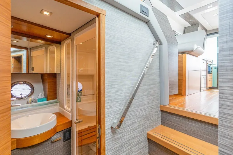  Yacht Photos Pics Luxurious interior of 2021 Tiara Yachts F44 Flybridge, featuring modern bathroom and sleek design.