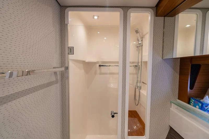  Yacht Photos Pics Luxurious bathroom interior of 2021 Tiara Yachts F44 Flybridge with modern shower design.