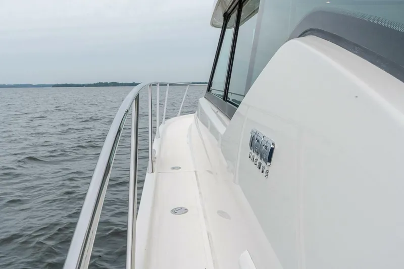  Yacht Photos Pics 2021 Tiara Yachts F44 Flybridge on open water, showcasing sleek design and craftsmanship.