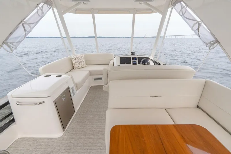  Yacht Photos Pics Luxurious interior of 2021 Tiara Yachts F44 Flybridge with elegant seating and ocean view.