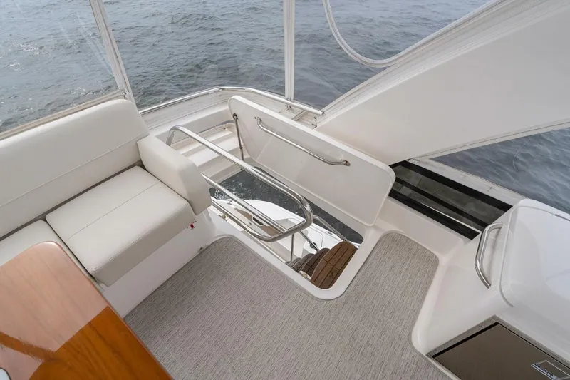  Yacht Photos Pics 2021 Tiara Yachts F44 Flybridge interior with seating and ocean view.