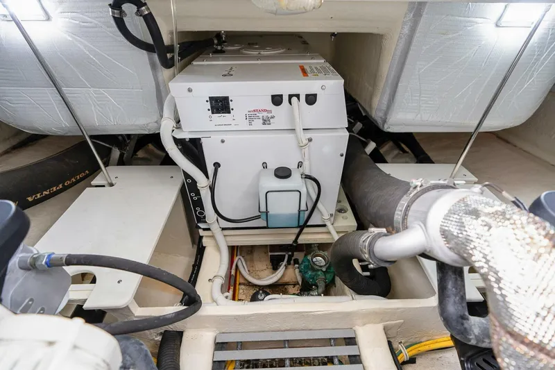  Yacht Photos Pics Engine room of 2021 Tiara Yachts F44 Flybridge with generator and wiring.