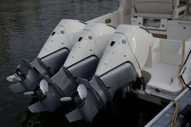  Yacht Photos Pics 2020 Boston Whaler 350 Realm with triple outboard engines on water.