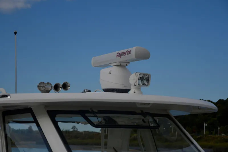  Yacht Photos Pics Boston Whaler 350 Realm 2020 boat with Raymarine radar and spotlight on roof.