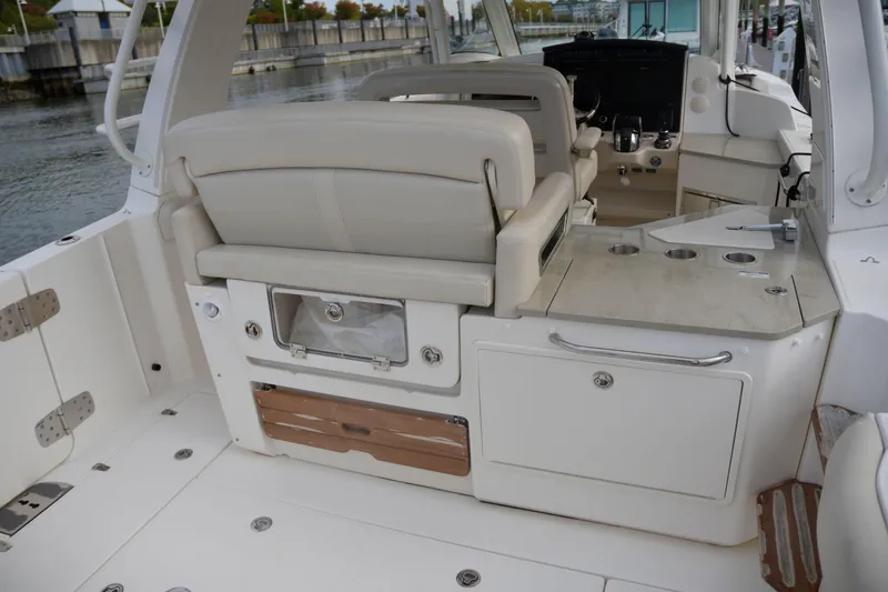  Yacht Photos Pics 2020 Boston Whaler 350 Realm boat interior with seating and storage compartments.