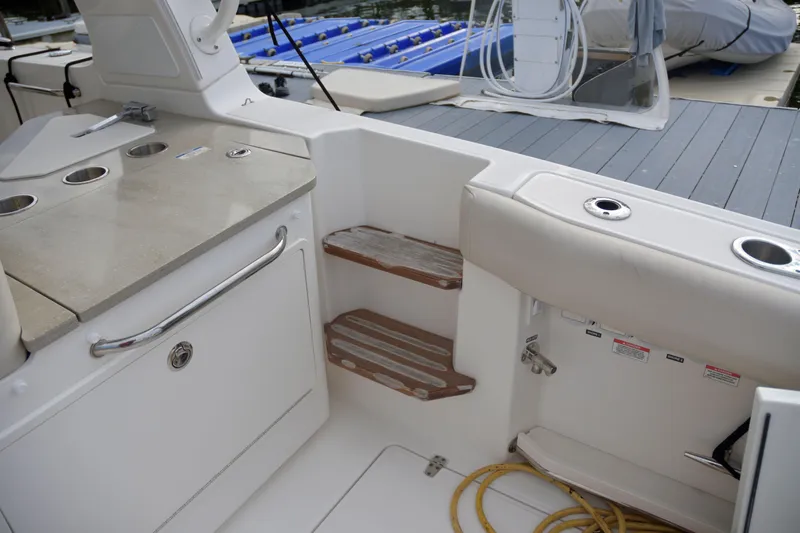  Yacht Photos Pics 2020 Boston Whaler 350 Realm interior with seating, steps, and storage.