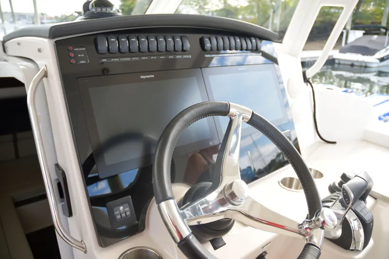  Yacht Photos Pics 2020 Boston Whaler 350 Realm helm with dual screens and steering wheel.
