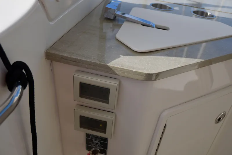  Yacht Photos Pics Boston Whaler 350 Realm 2020 boat interior with control panels and countertop.