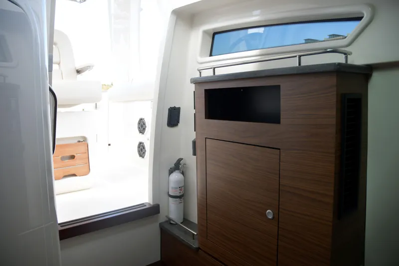  Yacht Photos Pics Interior of 2020 Boston Whaler 350 Realm, featuring wooden cabinetry and modern design elements.