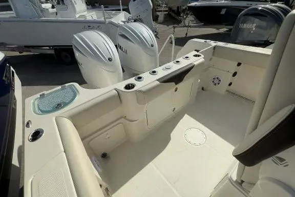 242-934 Yacht Photos Pics 2024 Sailfish 242 CC boat interior with Yamaha engines, featuring spacious seating and storage.