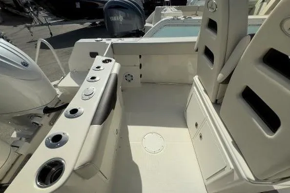 242-934 Yacht Photos Pics 2024 Sailfish 242 CC boat interior with seating and storage compartments.