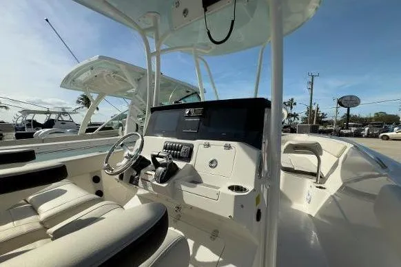 242-934 Yacht Photos Pics 2024 Sailfish 242 CC boat interior with modern helm and seating.