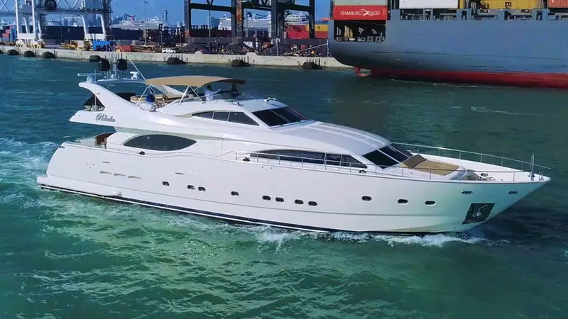  Yacht Photos Pics 2000 Ferretti Yachts Custom Line 94 cruising in a busy harbor.