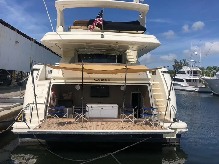 Paladin Yacht Photos Pics Ferretti Yachts Custom Line 94, 2000 model, docked with open deck and seating area.
