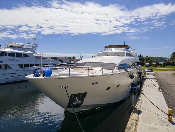  Yacht Photos Pics Ferretti Yachts Custom Line 94, 2000 model, docked at marina under blue sky.