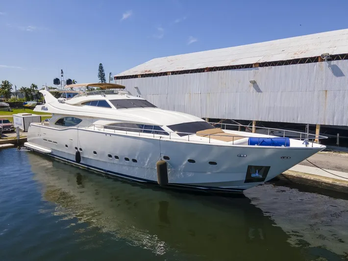  Yacht Photos Pics Ferretti Yachts Custom Line 94, 2000 model, docked at a marina under clear skies.